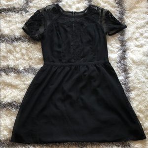 Black cocktail dress with lace sleeves